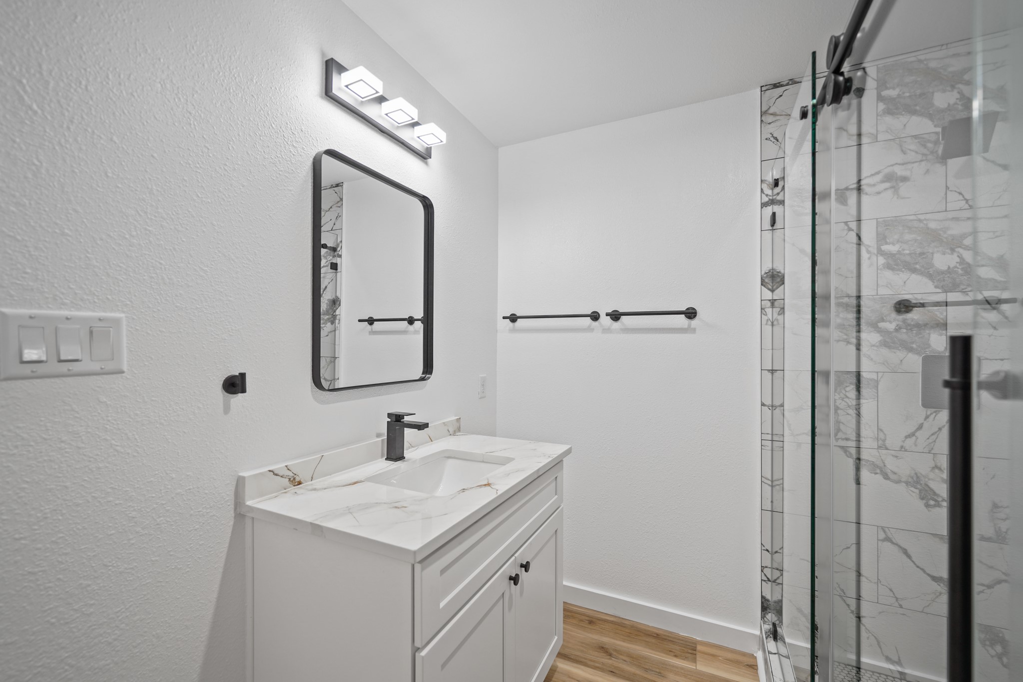 4154 Erby Street Houston, TX 77087 - Photo 19 of 36 a bathroom with a sink a vanity and a mirror