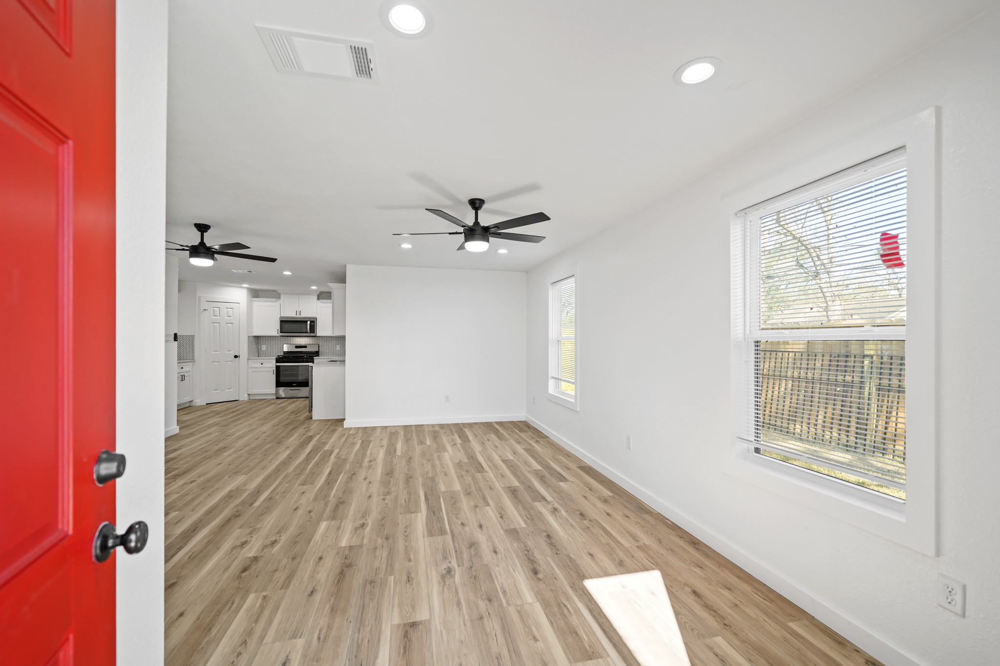 4154 Erby Street Houston, TX 77087 - Photo 22 of 36 a view of a kitchen with wooden floor and a kitchen space