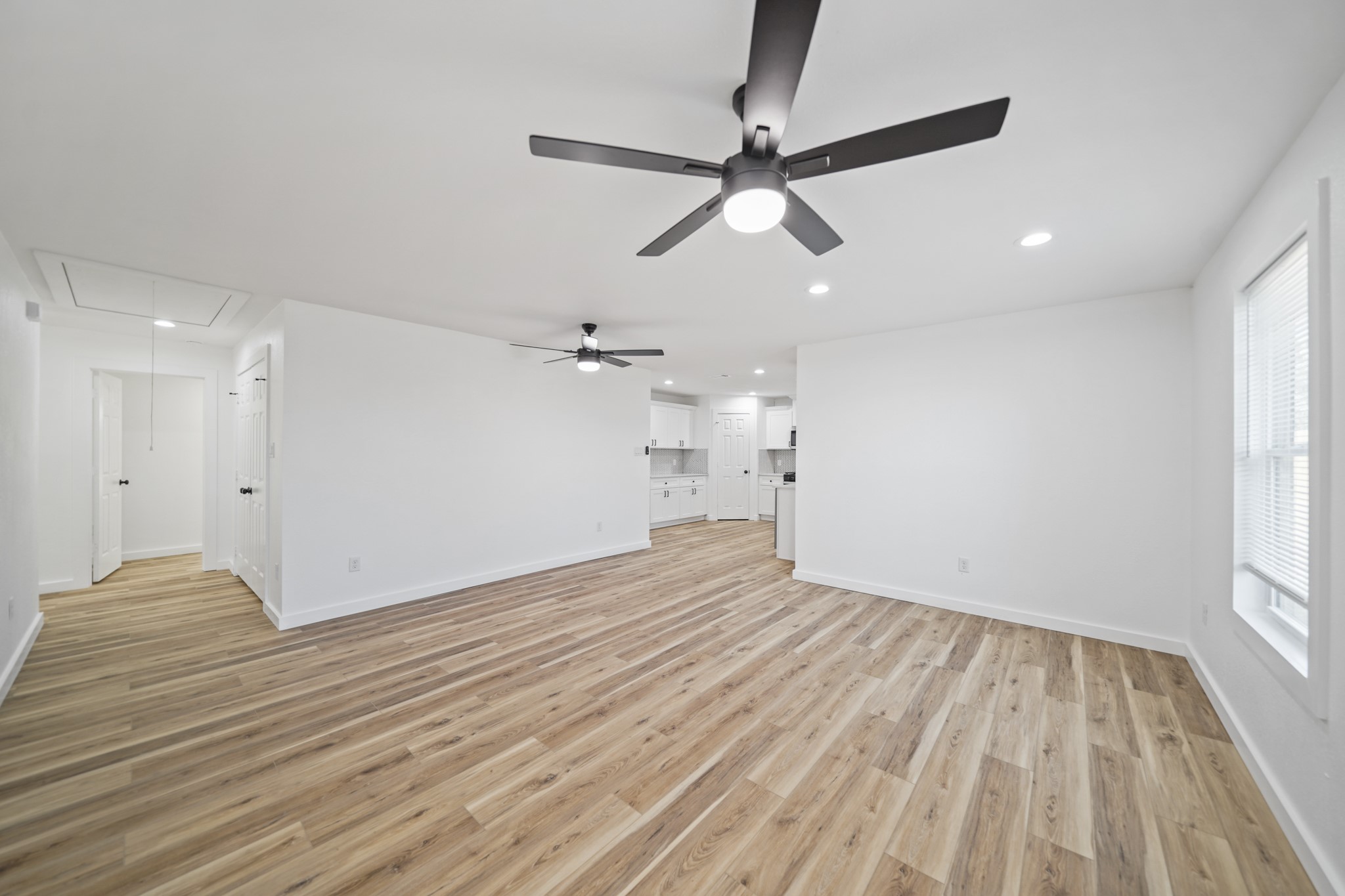 4154 Erby Street Houston, TX 77087 - Photo 23 of 36 a view of empty room with wooden floor and fan