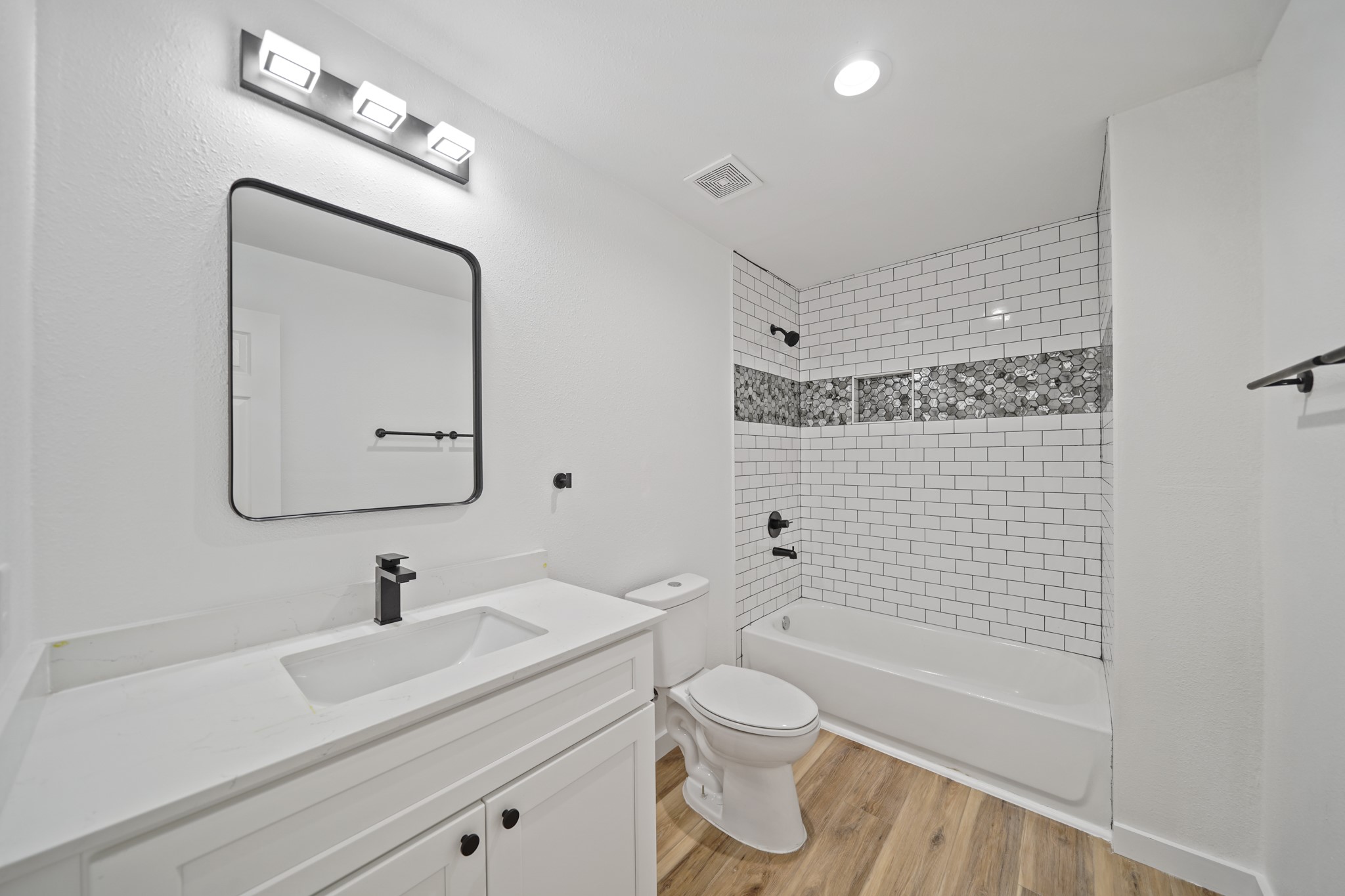 4154 Erby Street Houston, TX 77087 - Photo 29 of 36 a bathroom with a sink a toilet and shower
