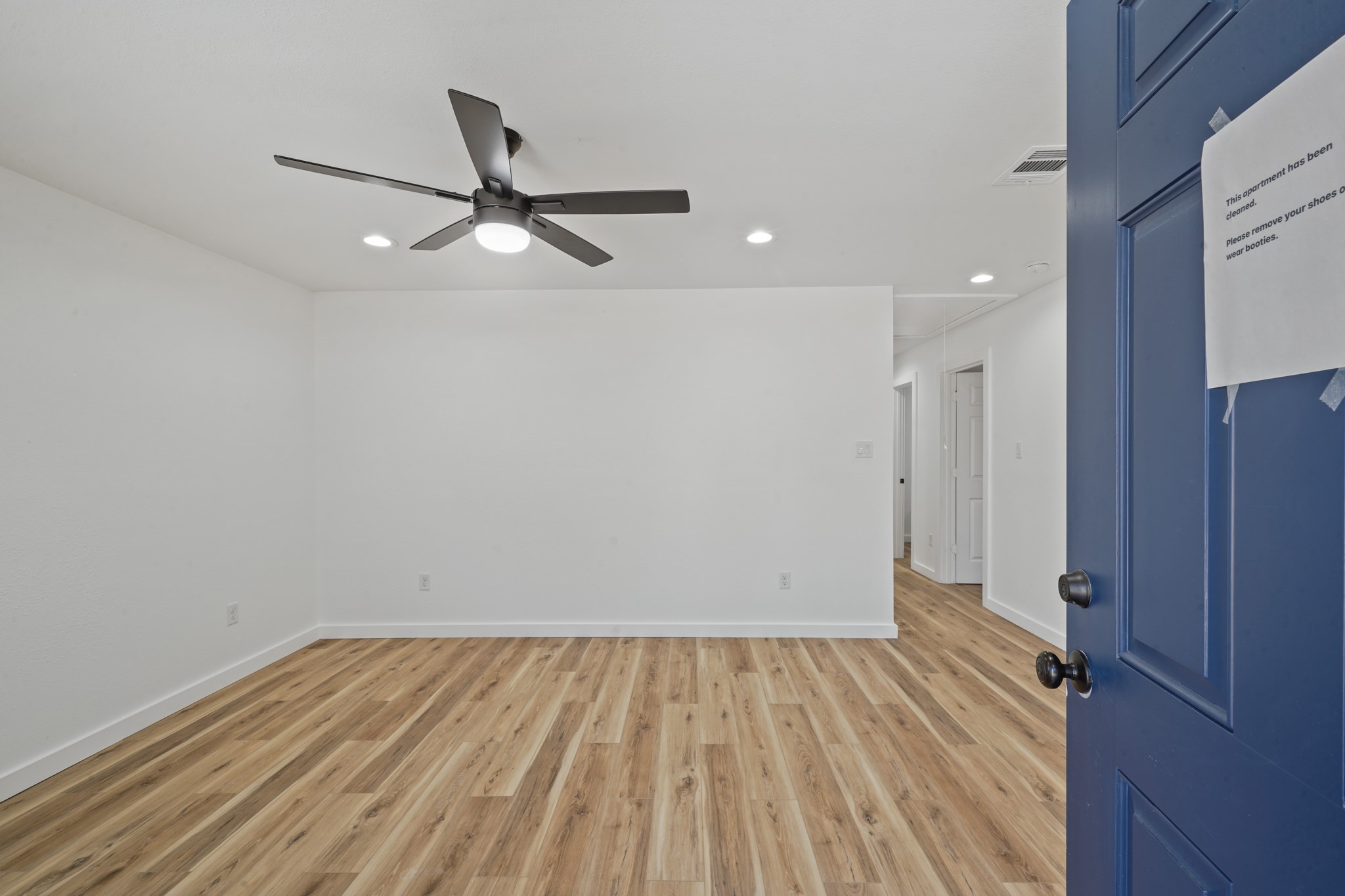 4154 Erby Street Houston, TX 77087 - Photo 3 of 36 a view of empty room with wooden floor
