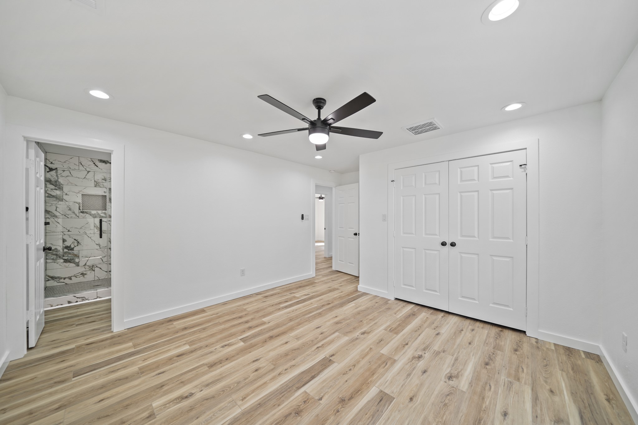 4154 Erby Street Houston, TX 77087 - Photo 32 of 36 wooden floor in an empty room with a window