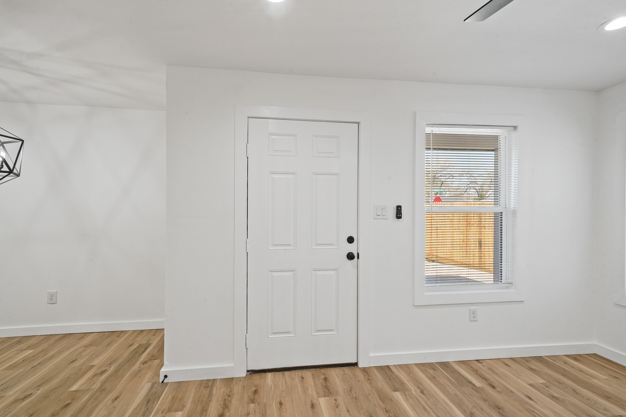 4154 Erby Street Houston, TX 77087 - Photo 4 of 36 a view of an empty room with wooden floor and closet
