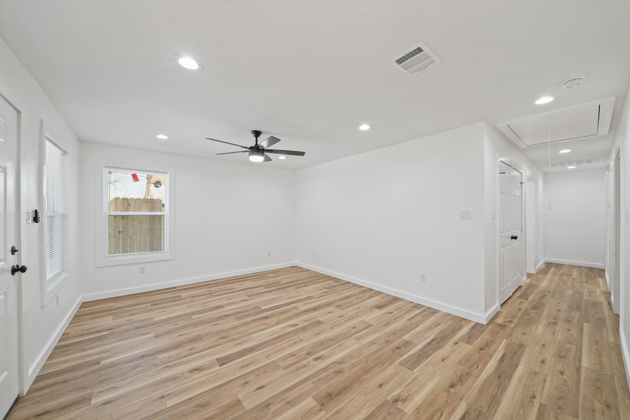 4154 Erby Street Houston, TX 77087 - Photo 6 of 36 a view of empty room with wooden floor