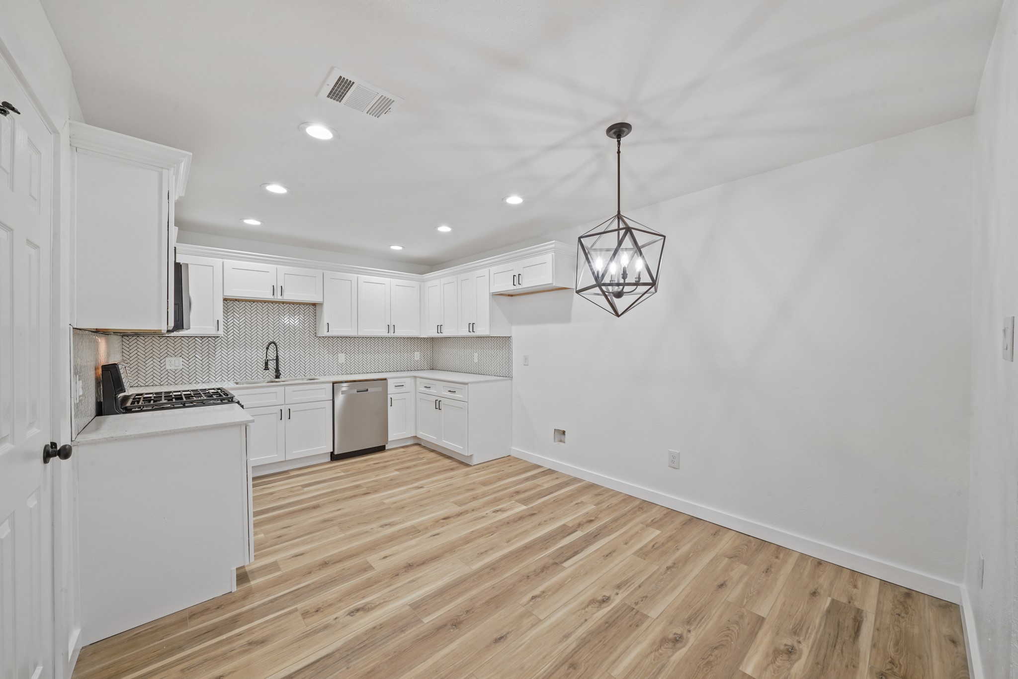 4154 Erby Street Houston, TX 77087 - Photo 8 of 36 a view of a kitchen with a sink and dishwasher