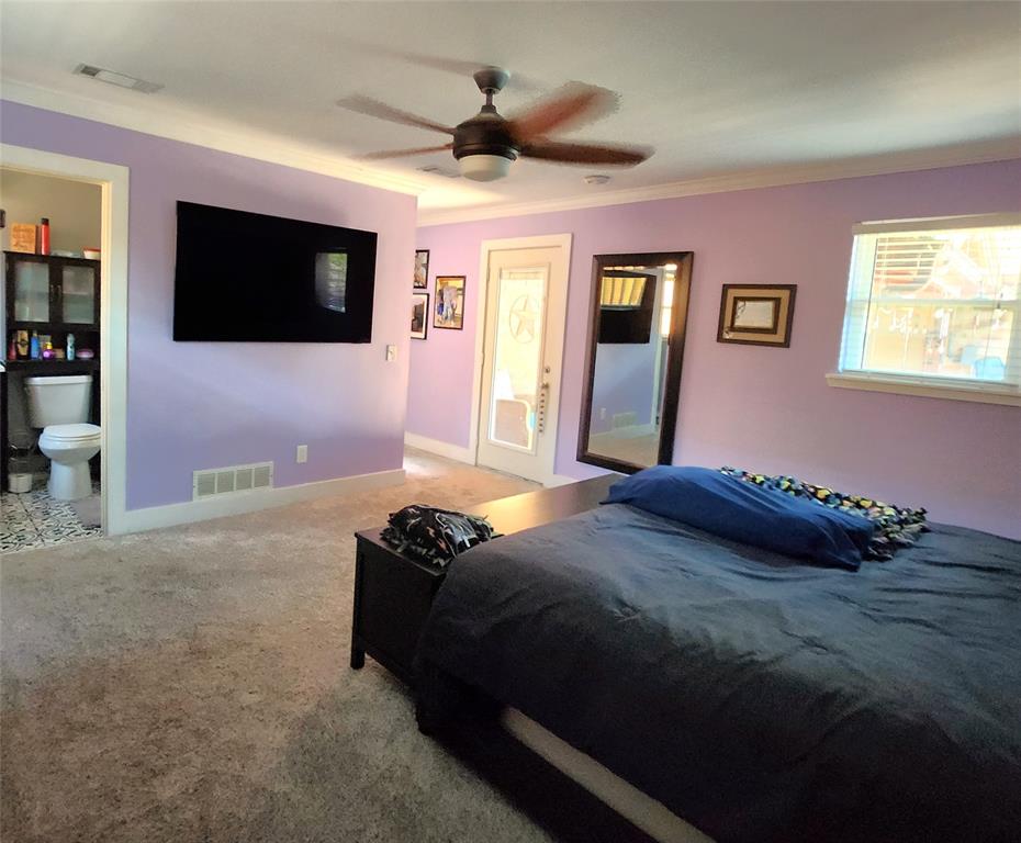 1023 Ridgefield Drive Plano, TX 75075 - Photo 29 of 39 a bedroom with a bed and a flat screen tv