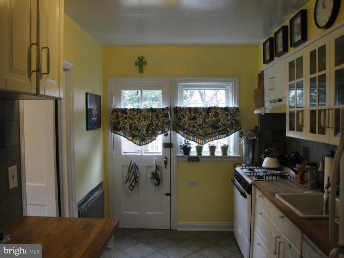 3800 Kimble Road Baltimore, MD 21218 - Photo 3 of 4 a kitchen with stainless steel appliances granite countertop a refrigerator and a stove