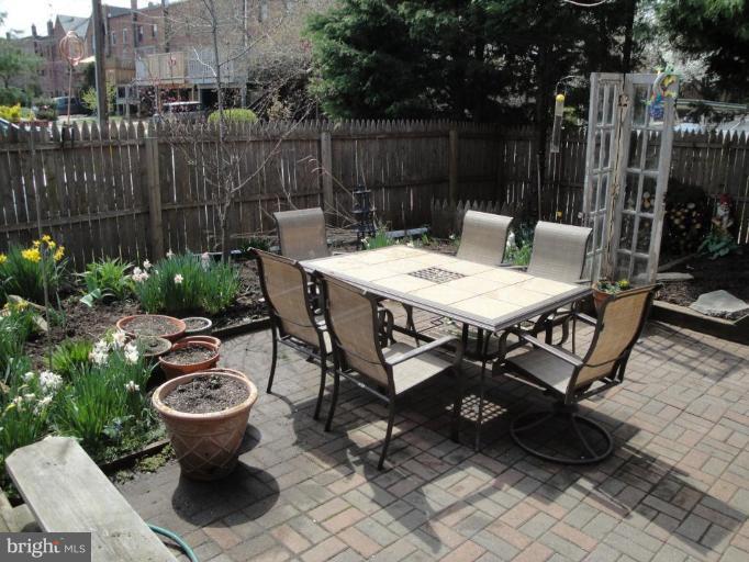 3800 Kimble Road Baltimore, MD 21218 - Photo 4 of 4 a view of a dinning table and chairs in the patio