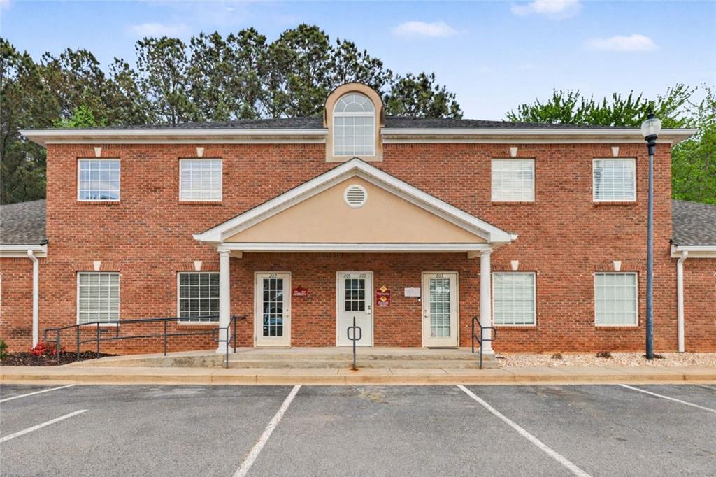 3745 Cherokee Street Northwest Kennesaw, GA 30144 - Photo 1 of 24 front view of a house with a yard