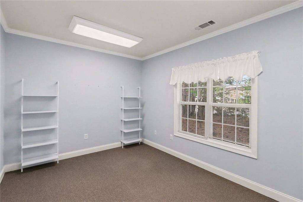 3745 Cherokee Street Northwest Kennesaw, GA 30144 - Photo 12 of 24 a view of an empty room with a window