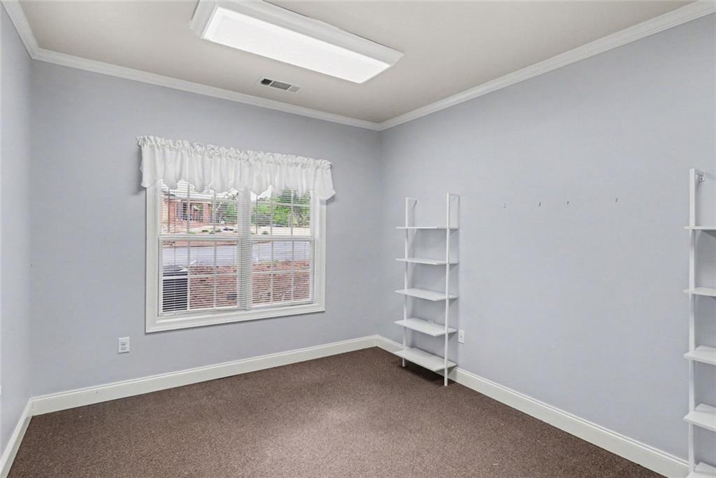 3745 Cherokee Street Northwest Kennesaw, GA 30144 - Photo 14 of 24 an empty room with a window