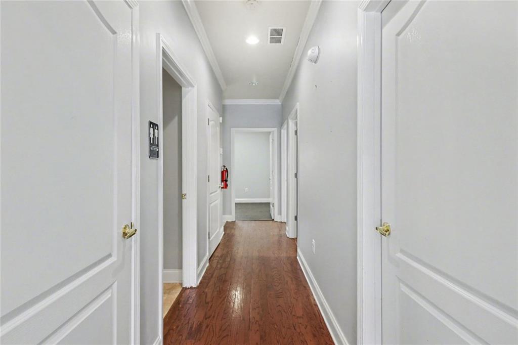 3745 Cherokee Street Northwest Kennesaw, GA 30144 - Photo 7 of 24 a view of hallway with wooden floor