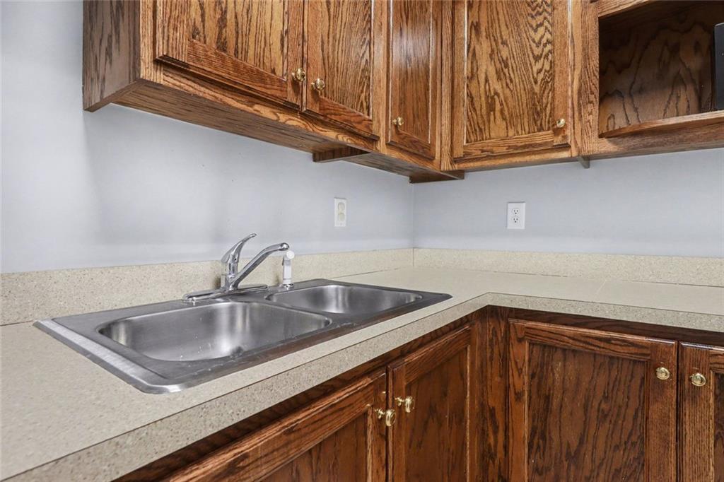 3745 Cherokee Street Northwest Kennesaw, GA 30144 - Photo 10 of 24 a kitchen with granite countertop a sink and cabinets