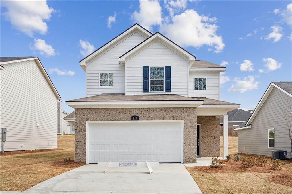 23 Whiterock Road Phenix City, AL 36869 - Photo 1 of 29 Traditional-style home featuring roof with shingles, driveway, central AC, a garage, and brick siding