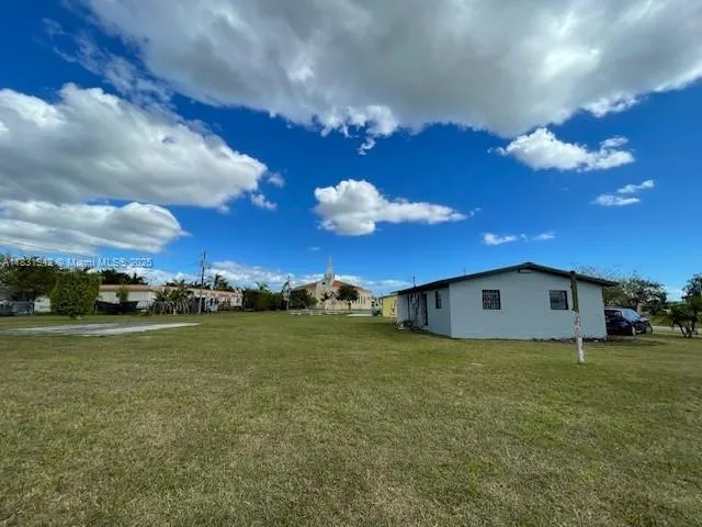 a view of a big room with table and chairs