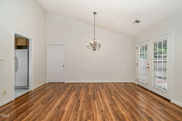 a kitchen with stainless steel appliances a stove a microwave and a refrigerator