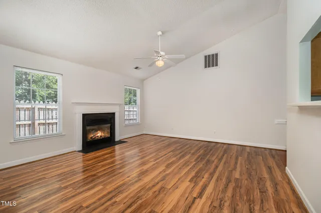 a view of a livingroom with wooden floor