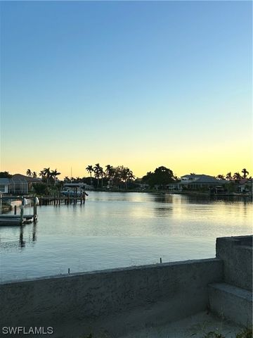 a view of a lake with houses in the back