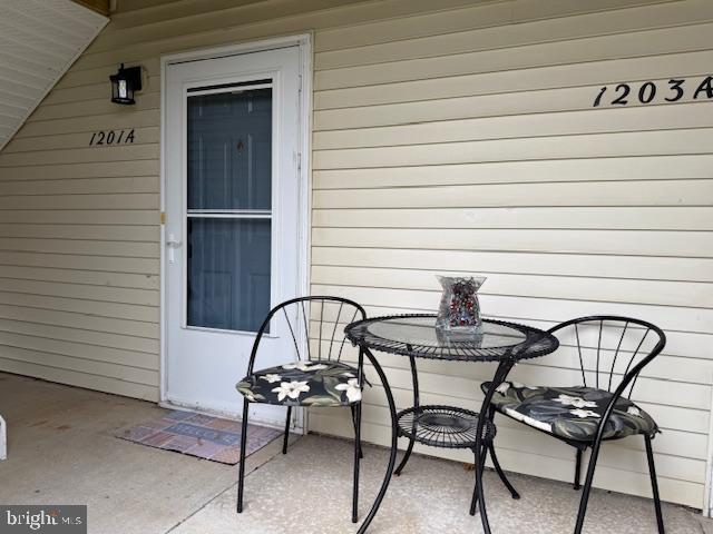 1201 Ginger Court Mount Laurel, NJ 08054 - Photo 3 of 18 a table and chairs in a balcony