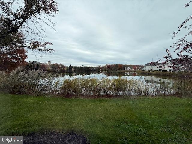 1201 Ginger Court Mount Laurel, NJ 08054 - Photo 4 of 18 a view of a lake with houses in the back