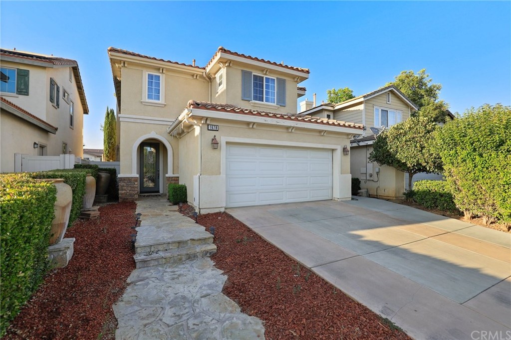 1678 Rigel Street Beaumont, CA 92223 - Photo 1 of 1 a front view of a house with a yard