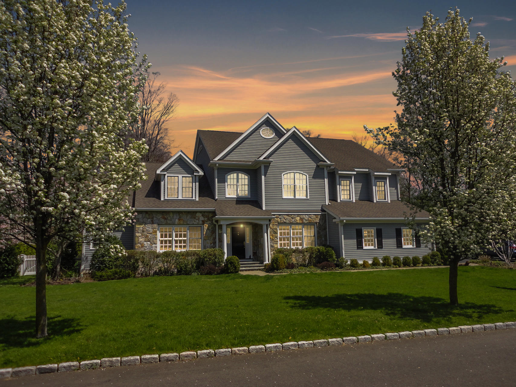 a front view of a house with a yard