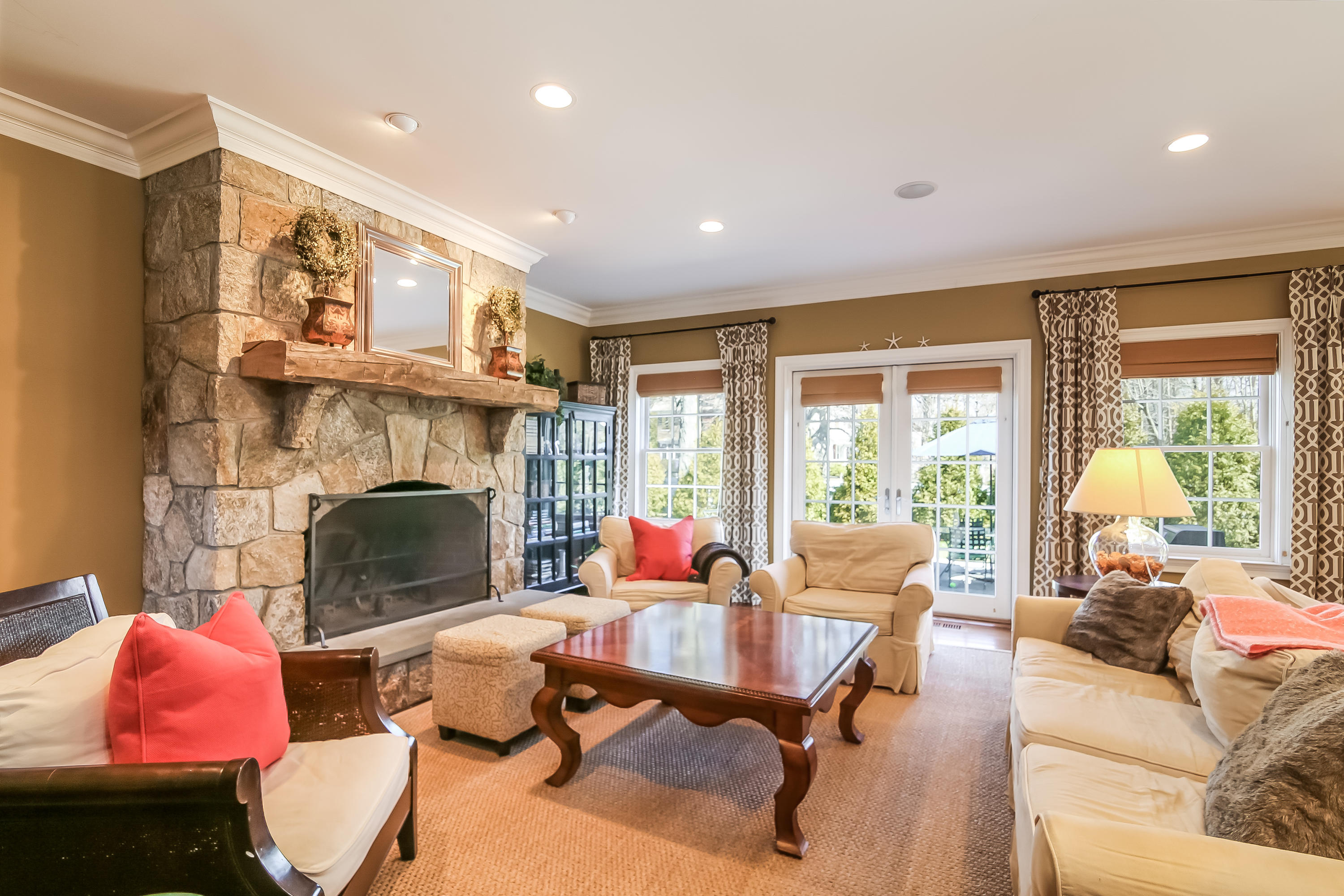3 Bishops Gate Road Darien, CT 06820 - Photo 11 of 61 a living room with furniture fireplace and a large window