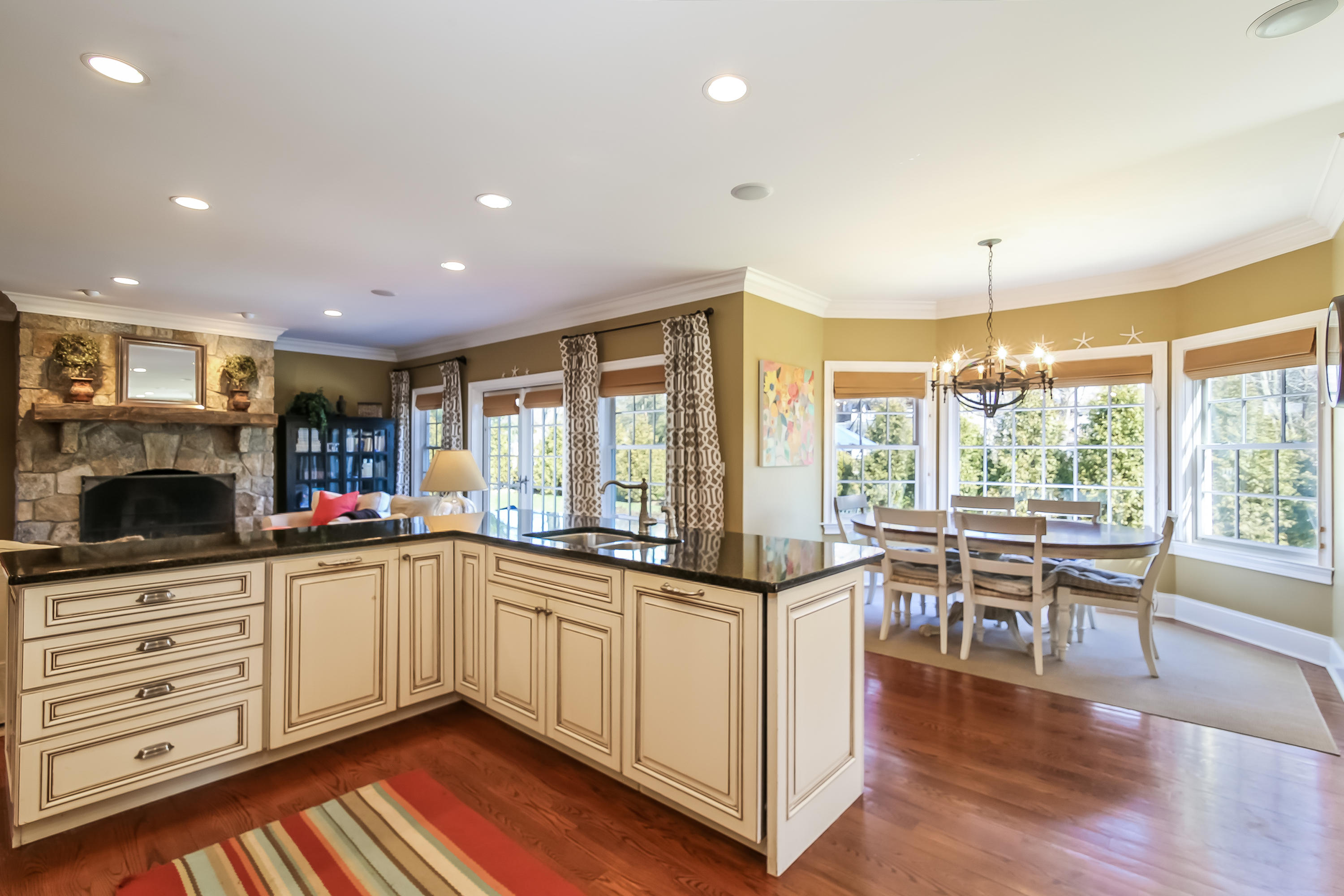 3 Bishops Gate Road Darien, CT 06820 - Photo 18 of 61 a kitchen with a sink a counter top space stainless steel appliances and a large window