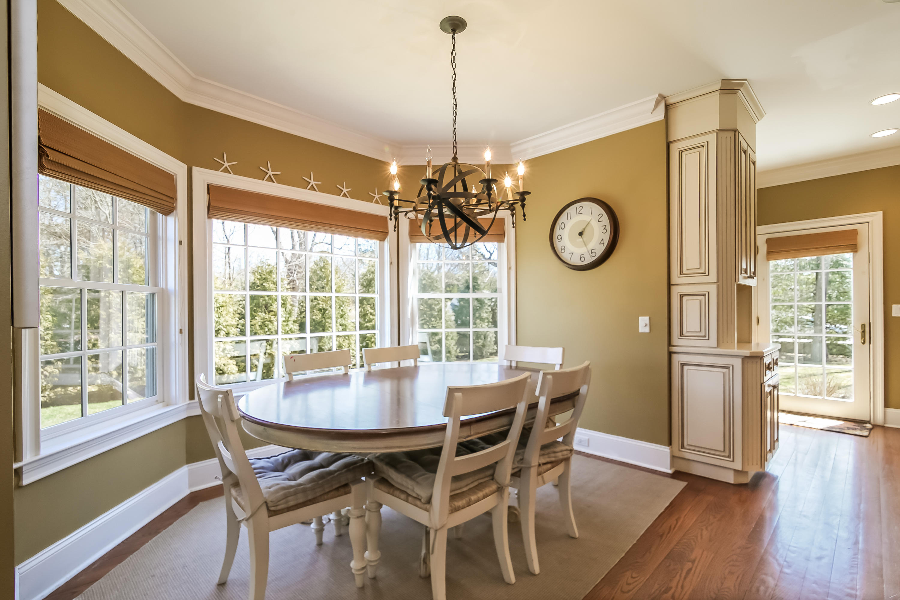 3 Bishops Gate Road Darien, CT 06820 - Photo 19 of 61 a view of a dining room with furniture window and wooden floor