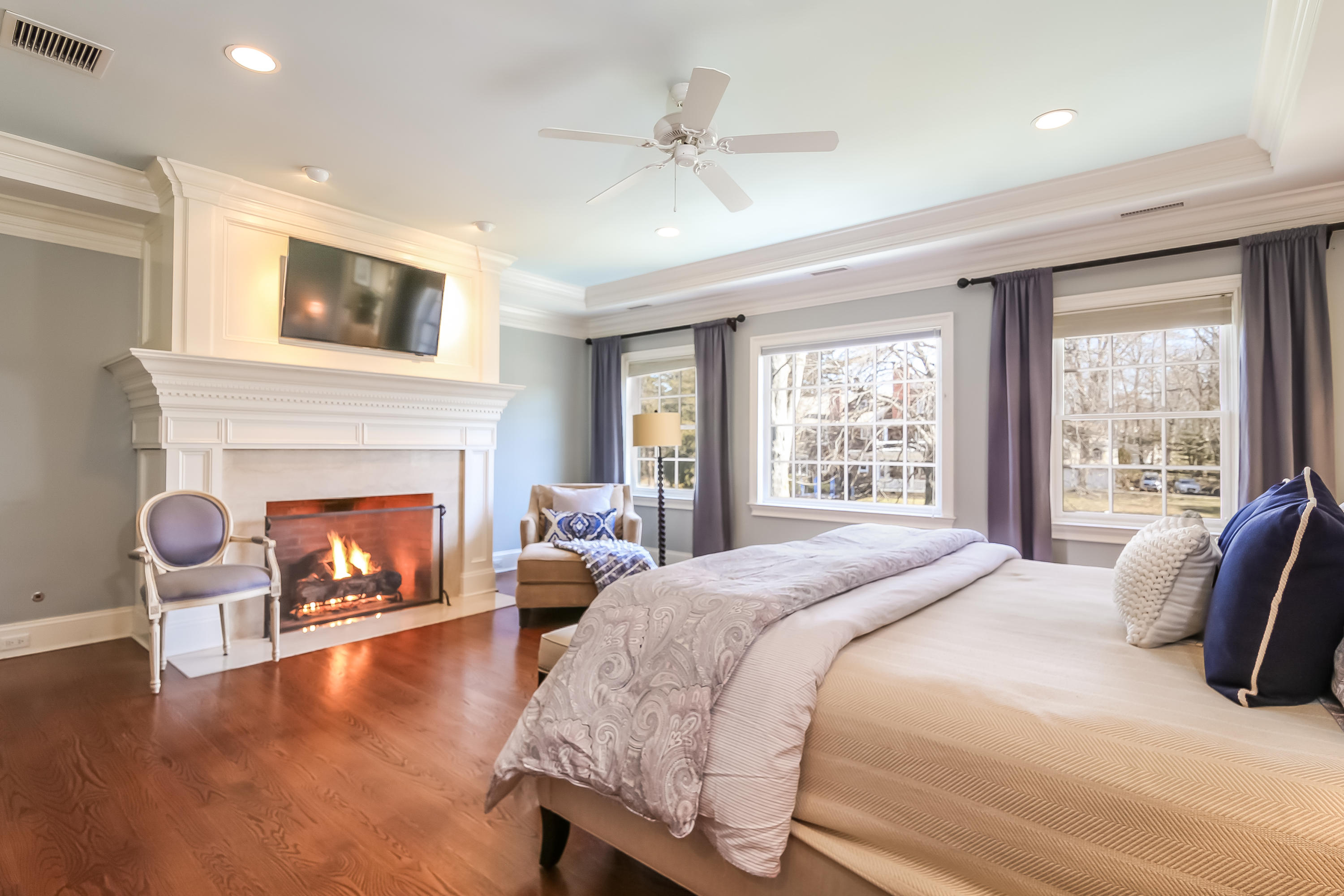 3 Bishops Gate Road Darien, CT 06820 - Photo 33 of 61 a bedroom with a bed and a fireplace