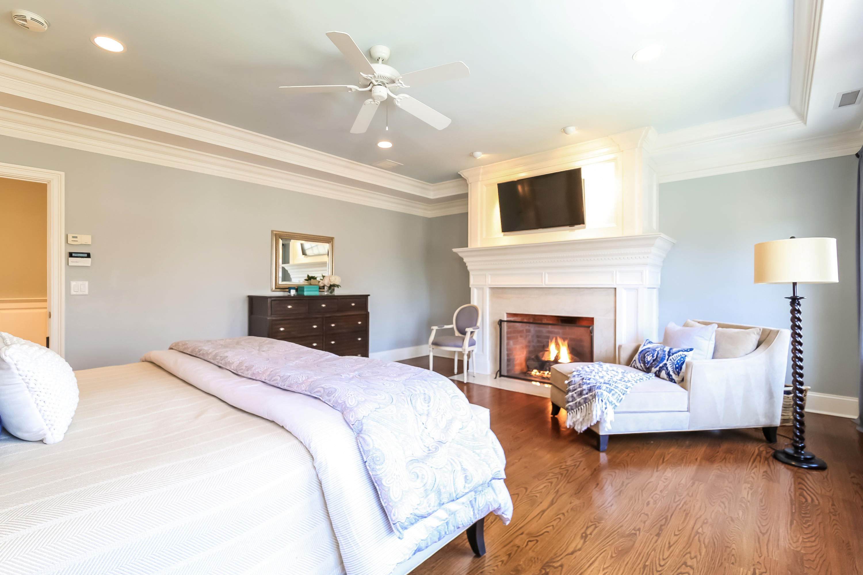 3 Bishops Gate Road Darien, CT 06820 - Photo 35 of 61 a spacious bedroom with a bed and a couch