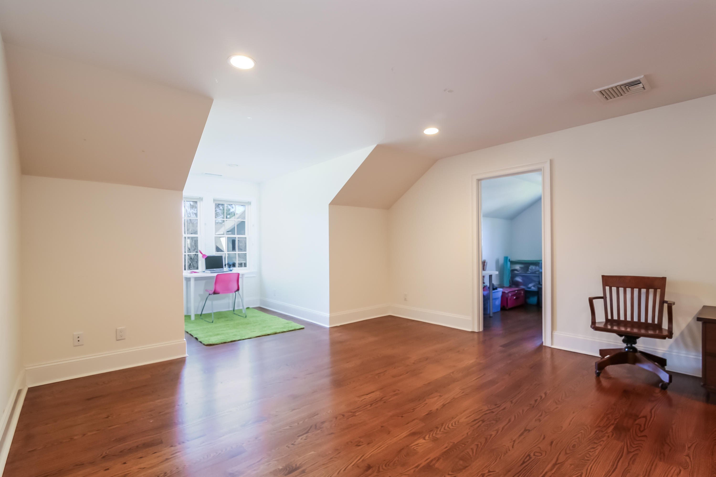 3 Bishops Gate Road Darien, CT 06820 - Photo 47 of 61 a view of an empty room with wooden floor and a window