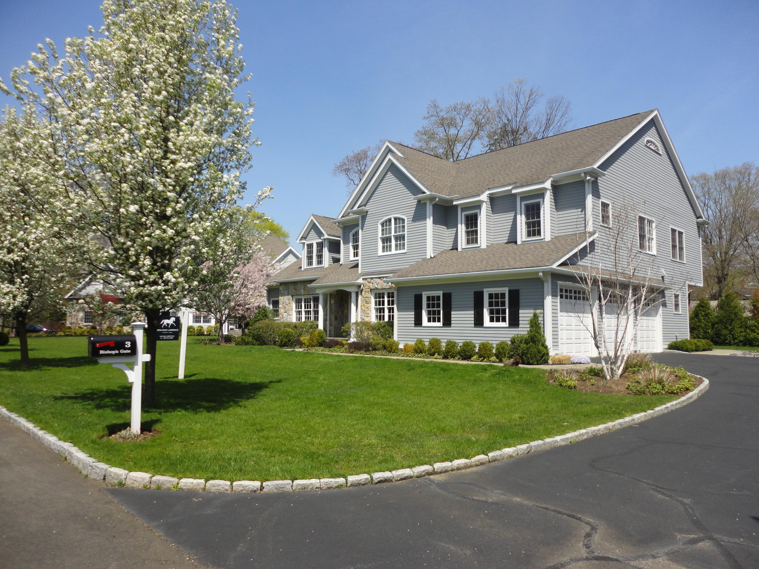 3 Bishops Gate Road Darien, CT 06820 - Photo 6 of 61 a front view of a house with a yard