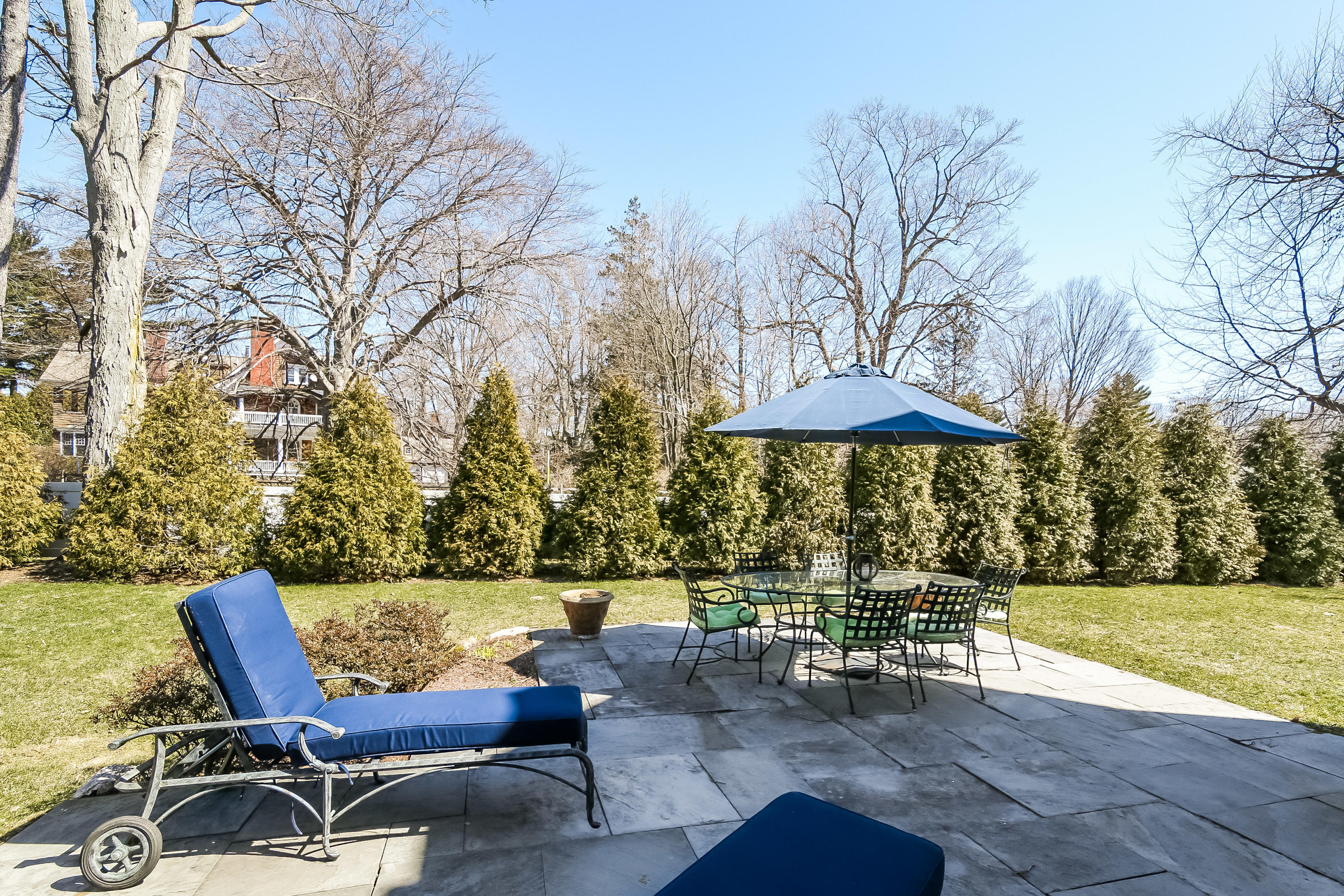 3 Bishops Gate Road Darien, CT 06820 - Photo 53 of 61 a view of a chairs and table on the patio