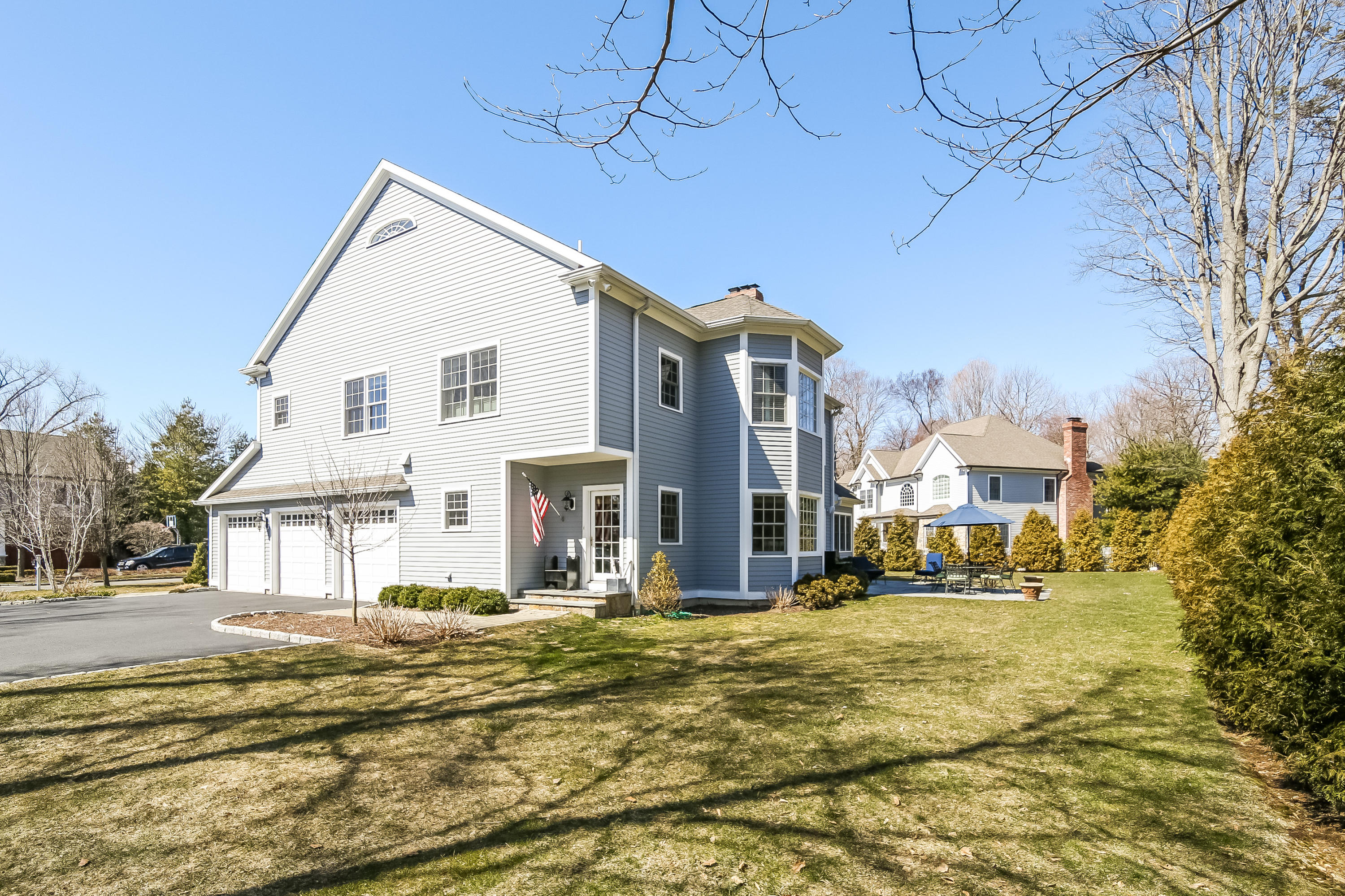 3 Bishops Gate Road Darien, CT 06820 - Photo 55 of 61 a view of a white house with a yard