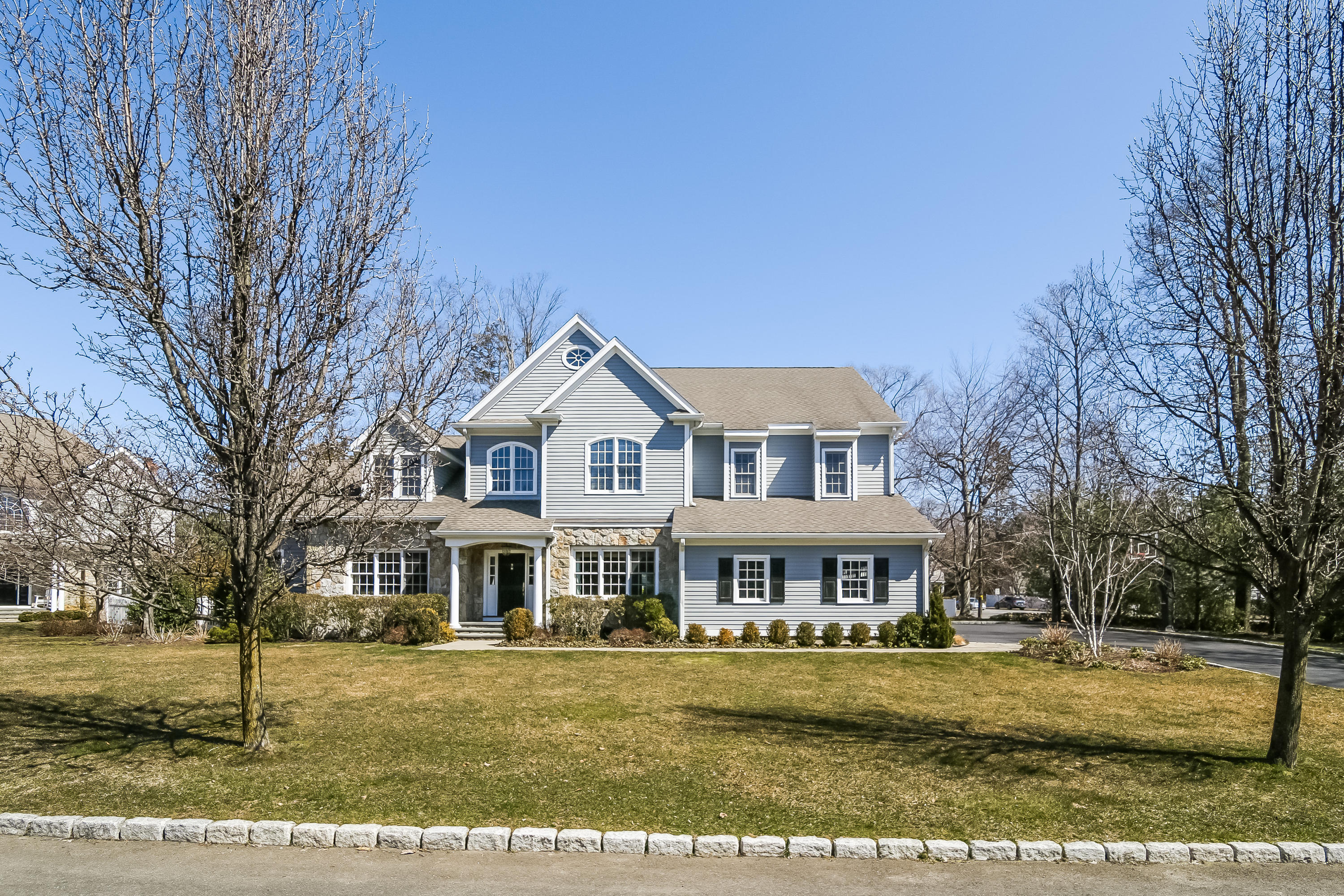 3 Bishops Gate Road Darien, CT 06820 - Photo 57 of 61 a front view of a house with a yard
