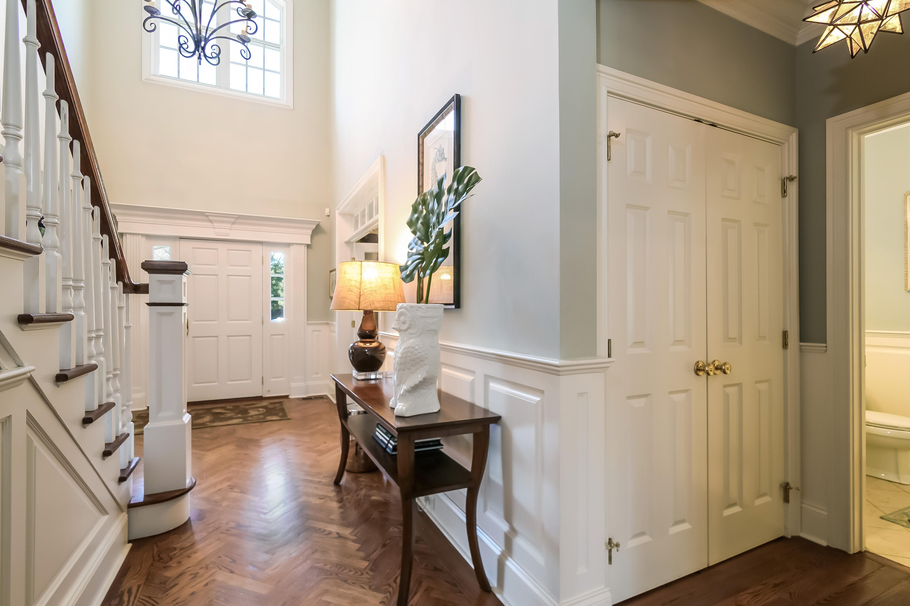 3 Bishops Gate Road Darien, CT 06820 - Photo 10 of 61 a view of an entryway with wooden floor and front door