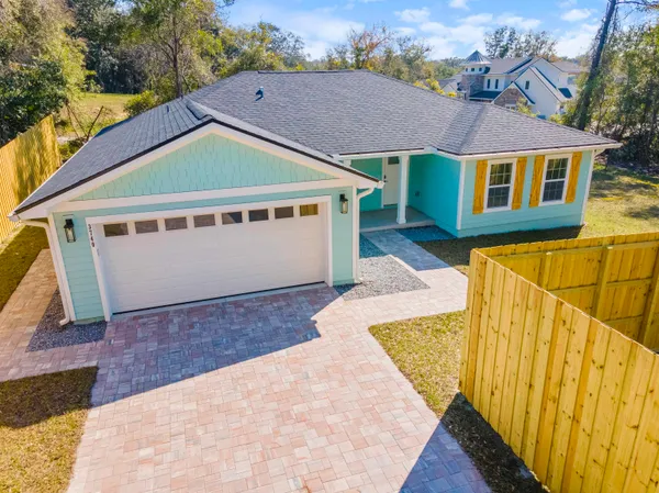 a view of house with backyard