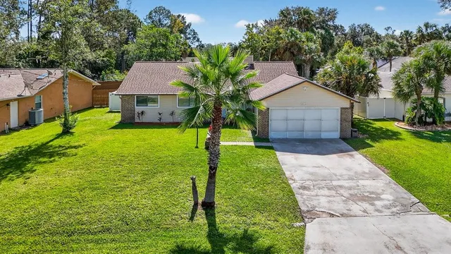 a view of a house with a back yard