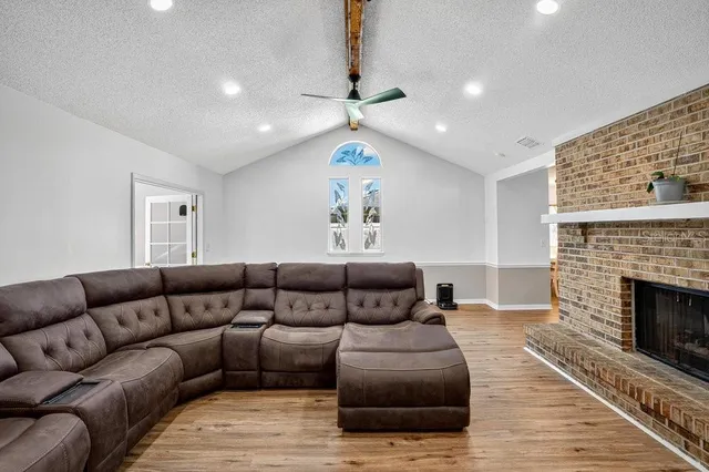a living room with furniture and a fireplace