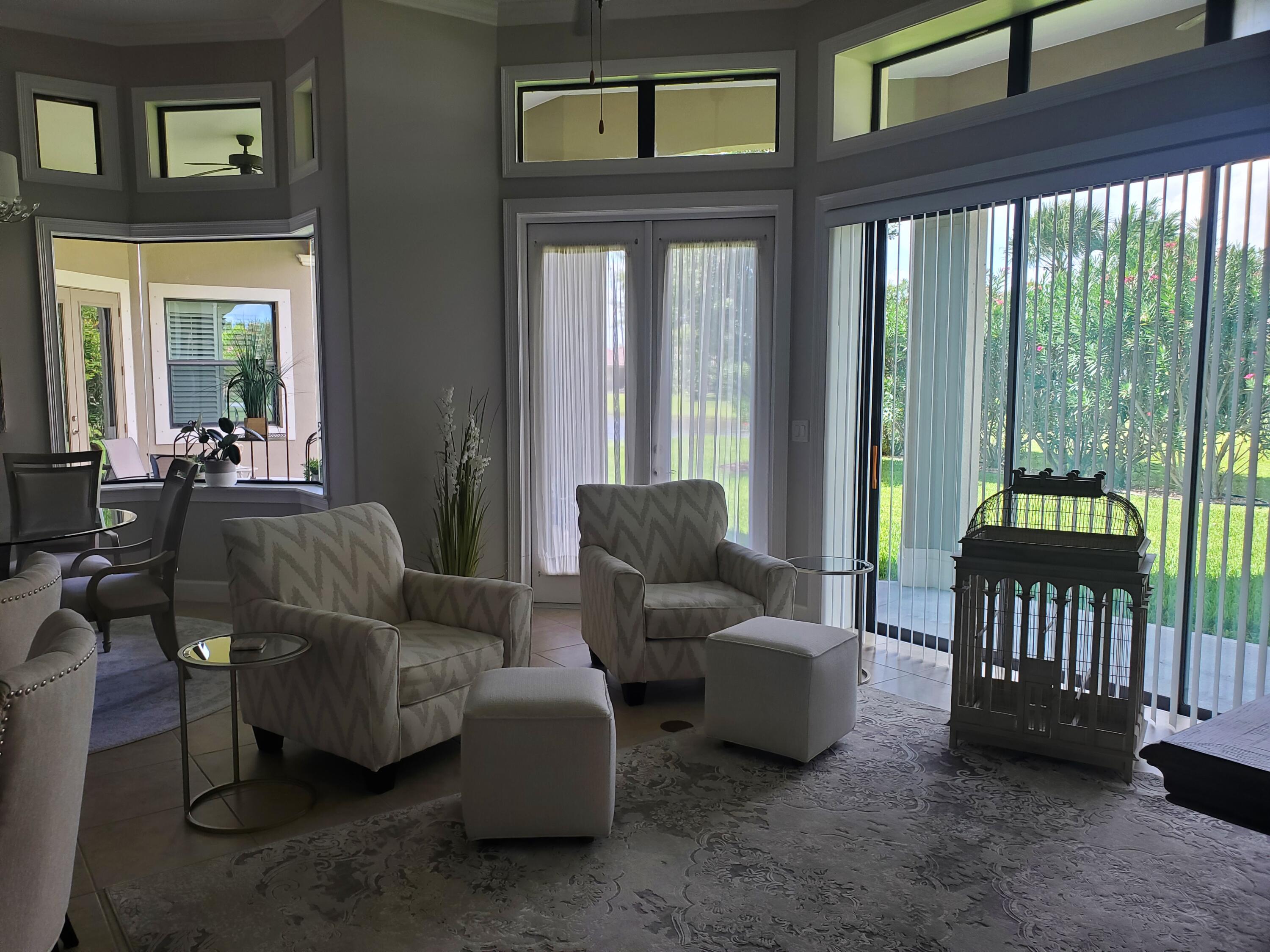 3179 Drummond Way Rockledge, FL 32955 - Photo 12 of 23 a living room with furniture and a large window