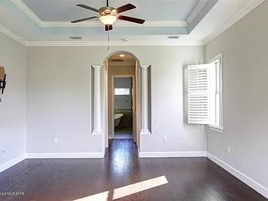 3179 Drummond Way Rockledge, FL 32955 - Photo 15 of 23 an empty room with wooden floor fan and windows