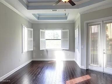 3179 Drummond Way Rockledge, FL 32955 - Photo 17 of 23 a view of an empty room with wooden floor and a window
