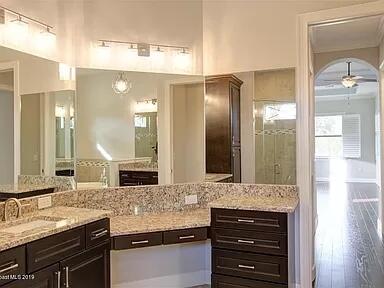 3179 Drummond Way Rockledge, FL 32955 - Photo 19 of 23 a bathroom with double vanity and a mirror