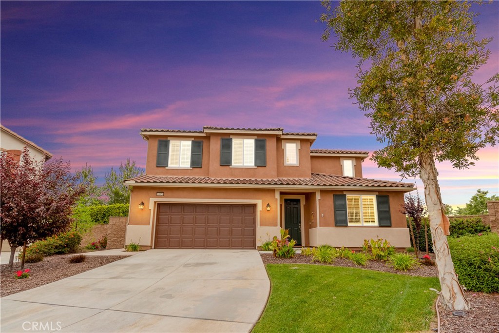 10820 Rio Grande Lane Riverside, CA 92503 - Photo 1 of 1 a front view of a house with a yard and garage