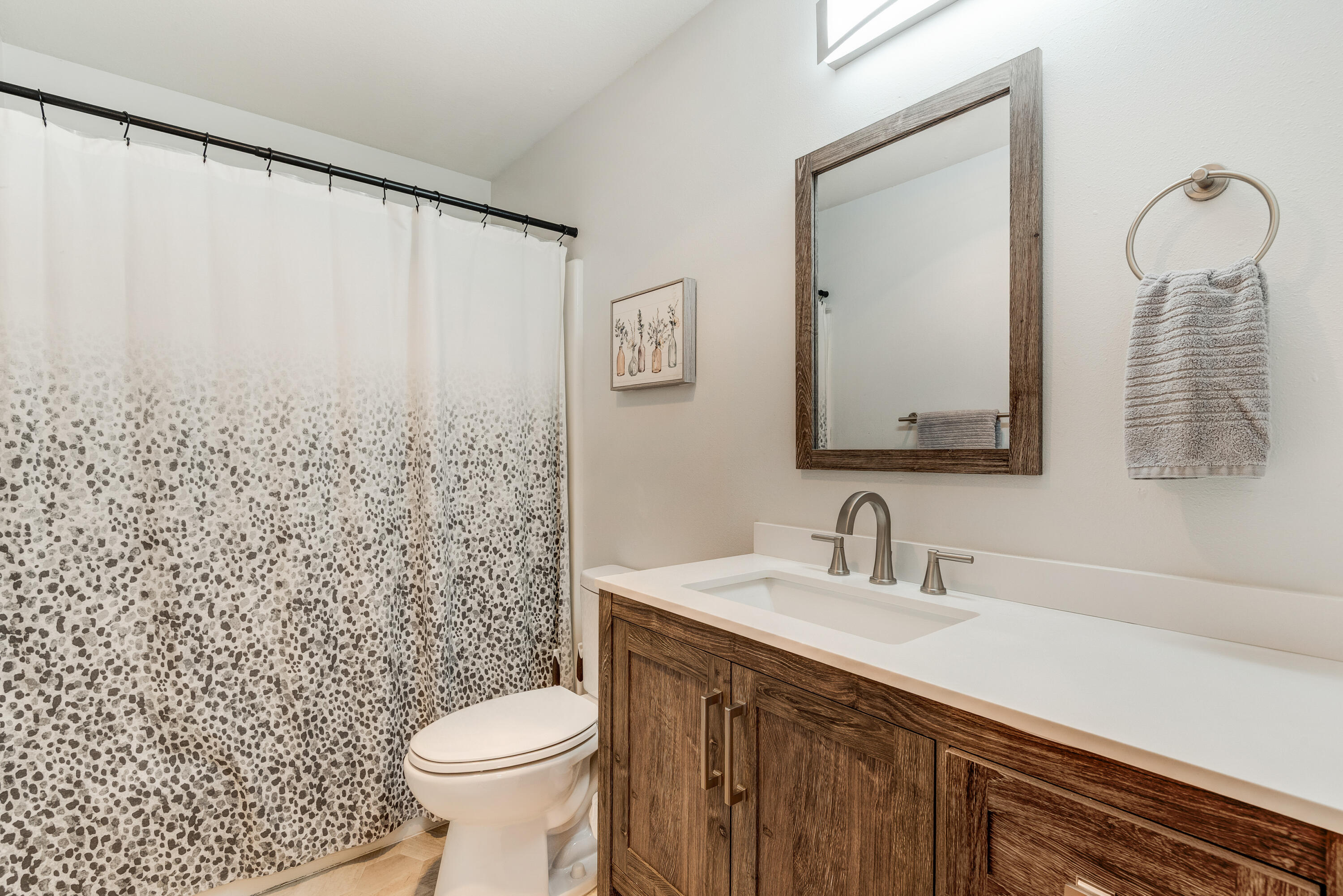 1916 Northeast Wichita Way Bend, OR 97701 - Photo 31 of 38 a bathroom with a sink a toilet and a mirror