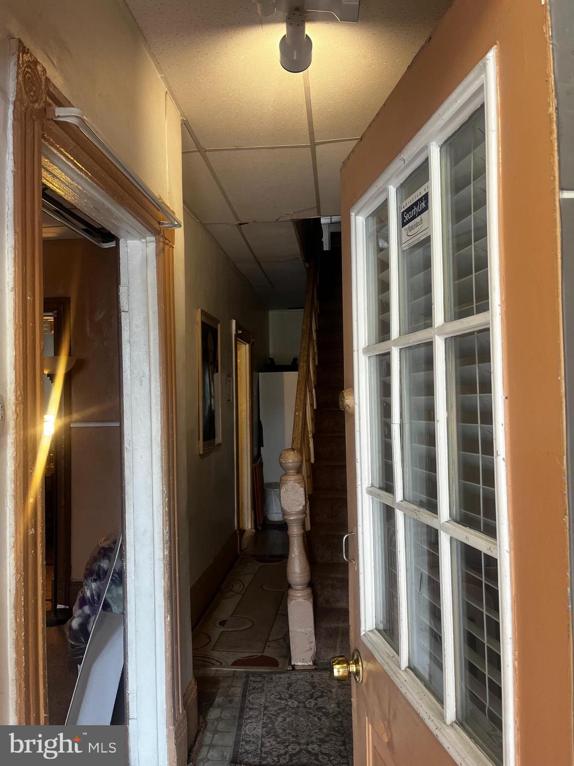633 10th Street Northeast Washington, DC 20002 - Photo 4 of 11 a view of a hallway with wooden floor and a bathroom
