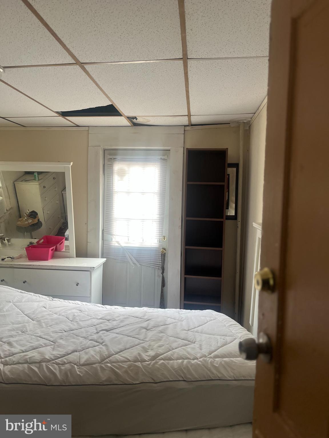 633 10th Street Northeast Washington, DC 20002 - Photo 8 of 11 a bedroom with a bed and a dresser