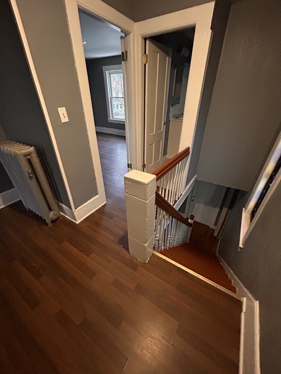 73 Lebanon Street Springfield, MA 01109 - Photo 11 of 19 a view of an empty room with wooden floor and door