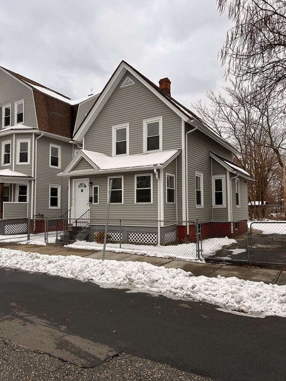 73 Lebanon Street Springfield, MA 01109 - Photo 2 of 19 a front view of a house with a yard